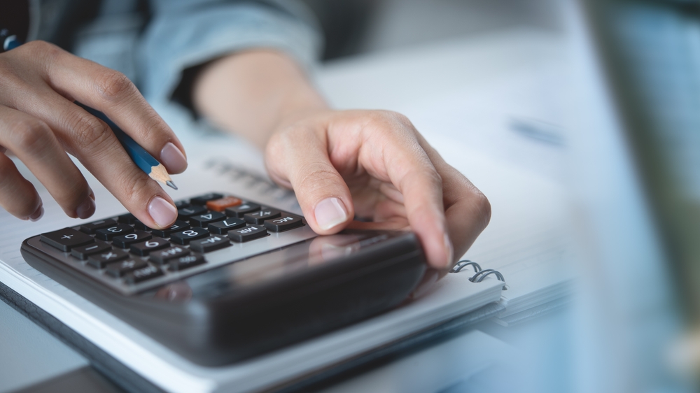 Woman Calculating Rental Property Depreciation for Tax Planning